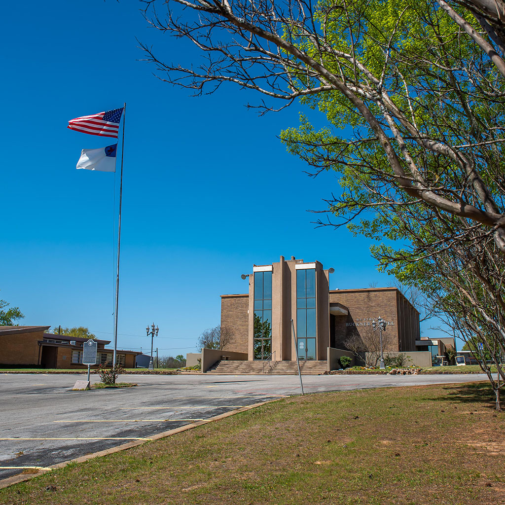 jacksovnille collge-2649-square Jacksonville College entrance with flags